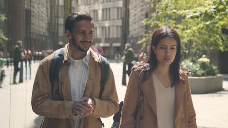 Muslim-Couple-On-Date-Talking-As-They-Walk-Along-City-Street-Together-2